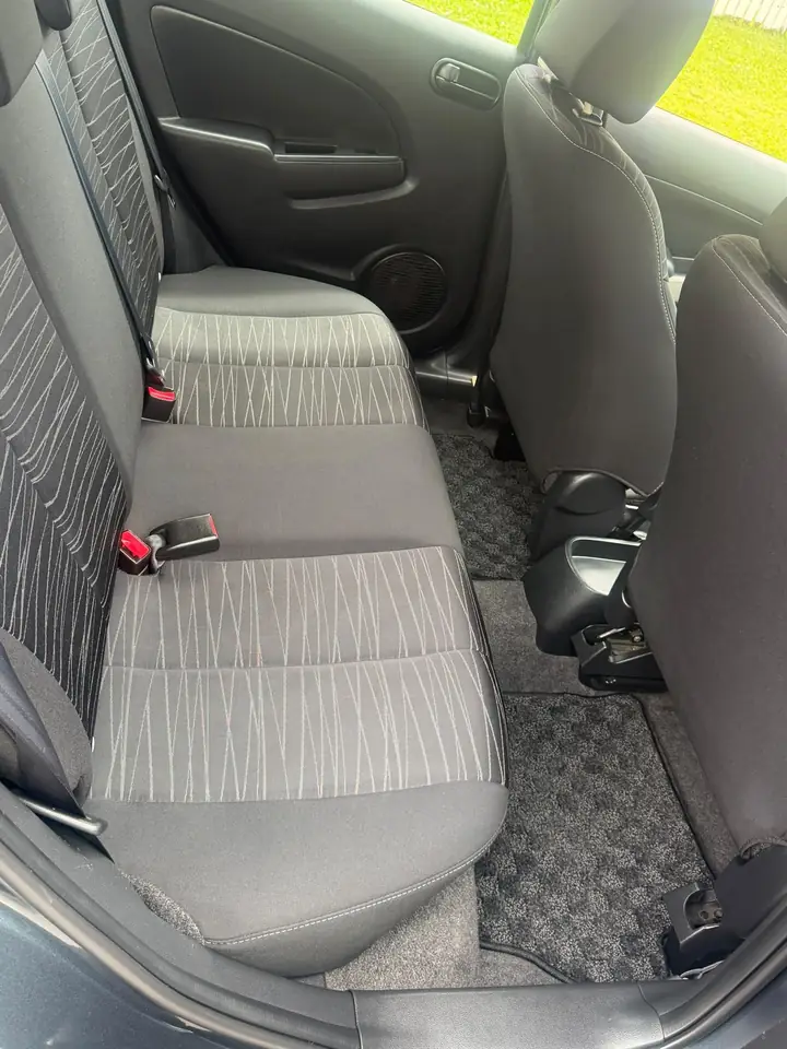 Second-row seats of the silver 2009 Mazda 2