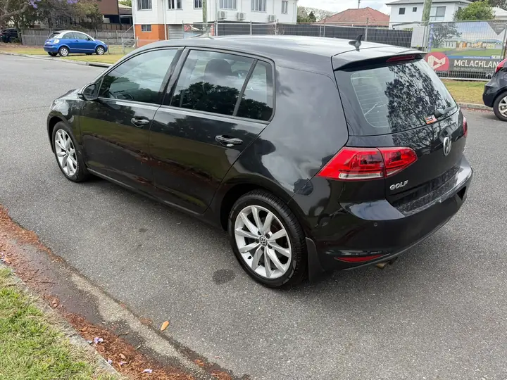 Rear three-quarter view of the black 2014 Volkswagen Golf