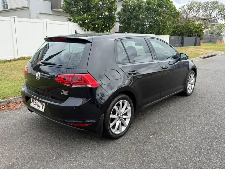 Rear three-quarter view of the black 2014 Volkswagen Golf