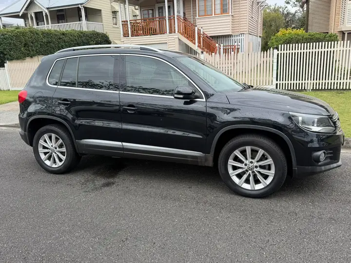 Left side of the black 2013 Volkswagen Tiguan